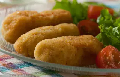 Croquetas de cebolla y papas a las finas hierbas